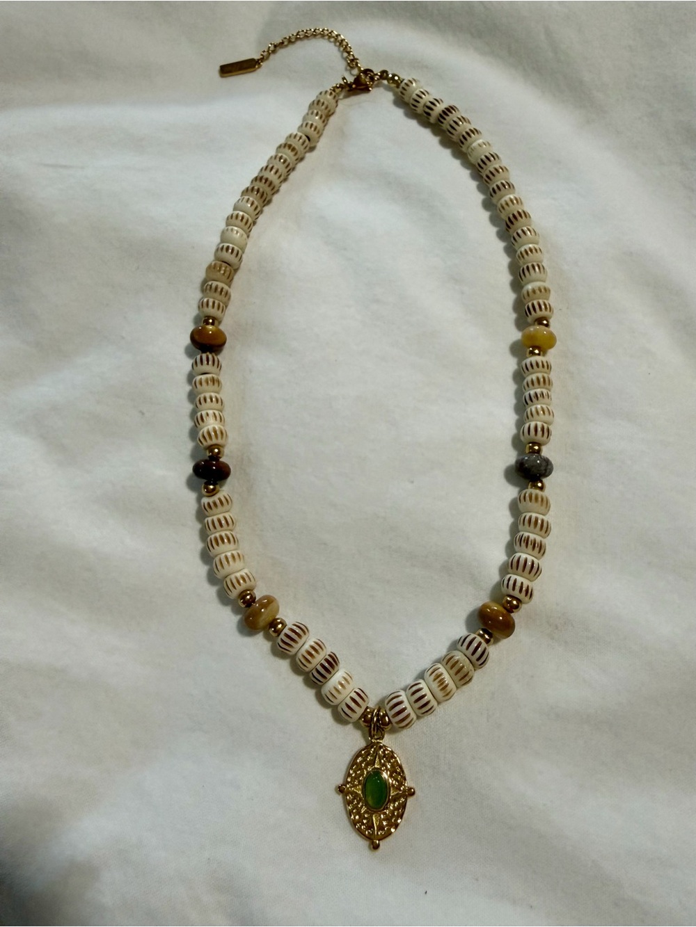 Gold-Accent Cream Beaded Necklace with Green Pendant